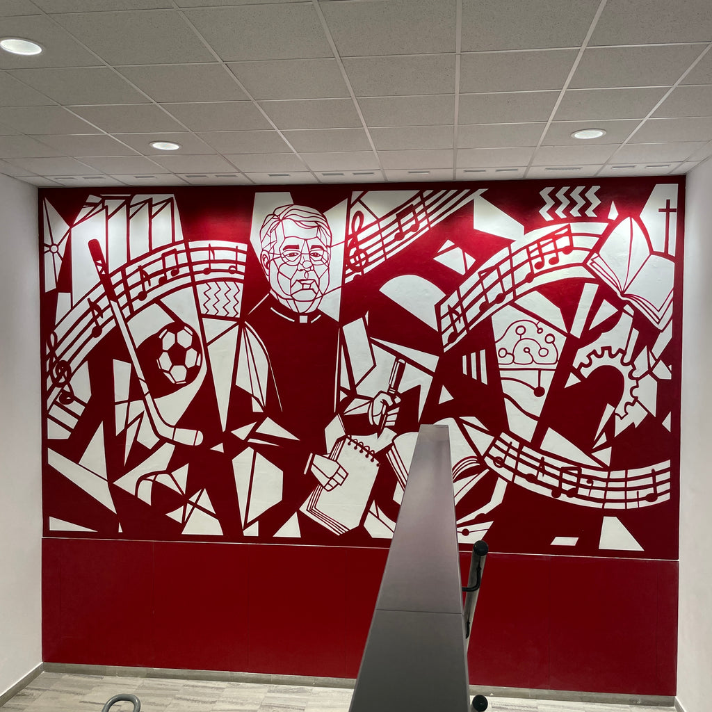 Mural interior en colegio color granate y blanco. Diseño geométrico estilo Guernica con figura de D. Luis rodeado de símbolos educativos.